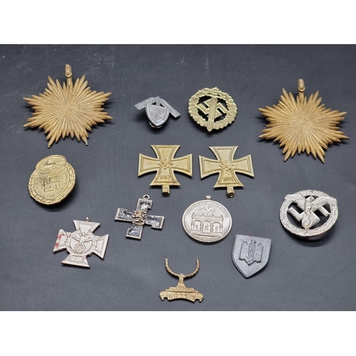 1329 - A collection of reproduction German Third Reich medals and badges. 