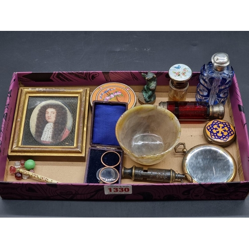 1330 - A mixed group of works of art, to include coloured glass scent bottles; a brass and enamel casket; a... 