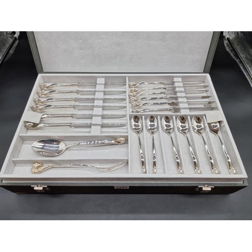 1337 - A canteen of electroplated cutlery, by Baigal, for six, with horse head terminals.   ... 