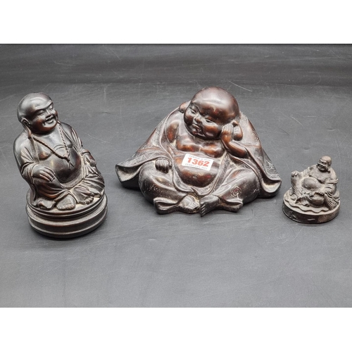 1362 - Three resin Buddhas, largest 13.5cm. 