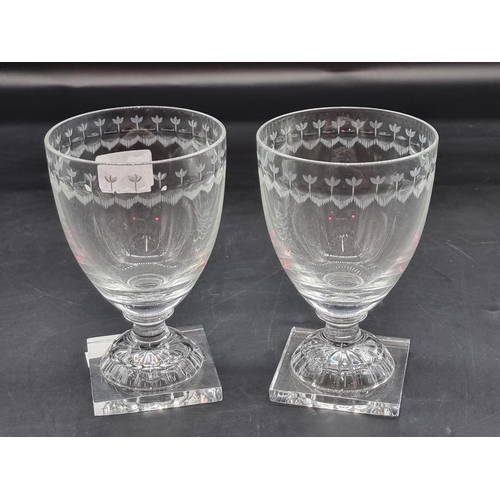 1367 - WITHDRAWN FROM SALE A pair of clear glass pedestal rummers, with engraved decoration to the rim, 13.... 