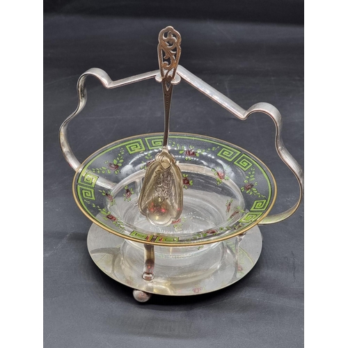 1375 - A glass and electroplate preserve dish, with painted decoration, 14.5cm high, with associated spoon;... 