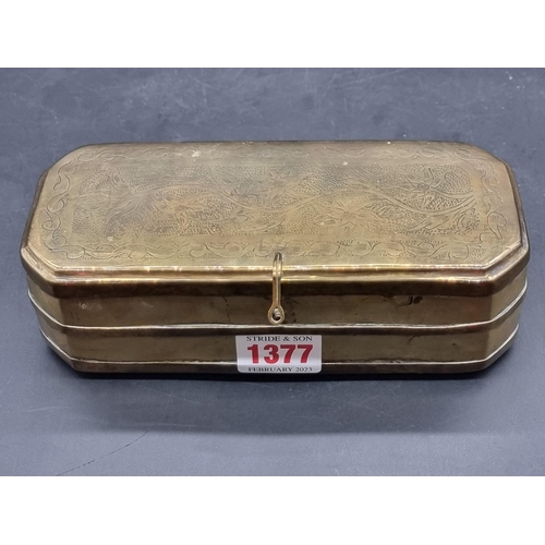 1377 - An 18th century Dutch brass tobacco box, engraved with floral scrolls, 18cm wide. ... 