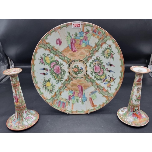 1382 - A collection of Chinese famille rose porcelain, Qing, charger, 35cm diameter; candlesticks, 20cm hig... 