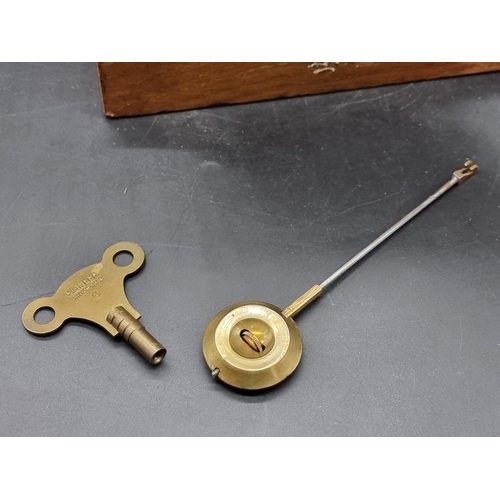 1384 - A late Victorian oak mantel clock, 25.5cm high, with pendulum.