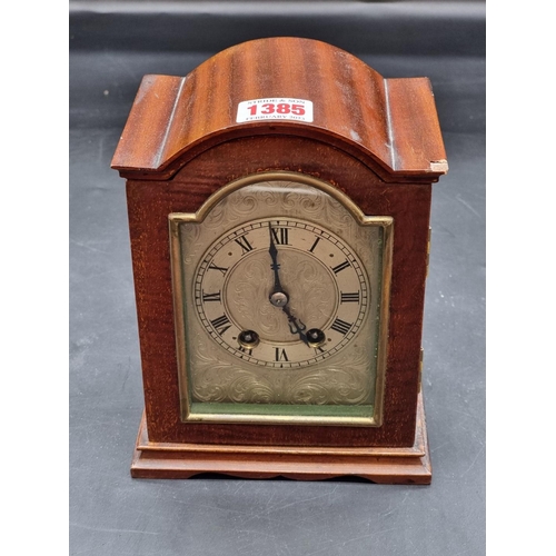 1385 - An early 20th century mahogany dome top mantel clock, with silvered dial, 18.5cm high, (chip to case... 