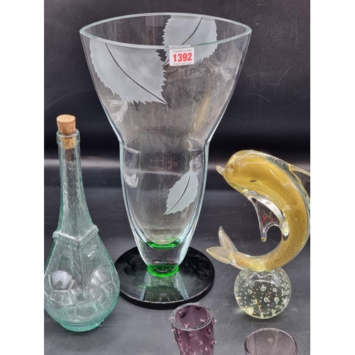 1392 - A collection of clear and coloured glass, to include a large vase, 40cm high; and a dolphin, 25.5cm ... 