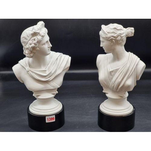 1399 - A pair of Parian busts of Apollo and Artemis, 29cm high, each on ebonized socle. ... 