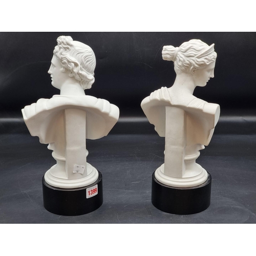 1399 - A pair of Parian busts of Apollo and Artemis, 29cm high, each on ebonized socle. ... 