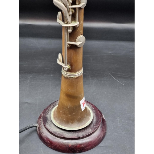 1406 - A novelty clarinet table lamp, total height 68cm. 