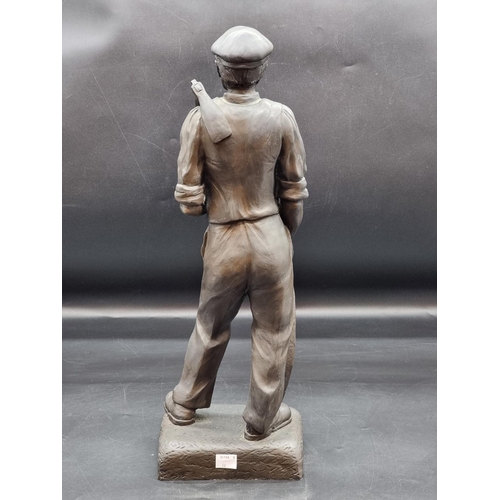 1408 - A bronzed resin figure of a carpenter, 49cm high. 