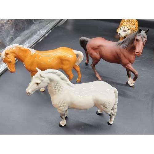 1414 - A collection of Beswick animals, to include a 'Spirit of Perth' horse. (10)