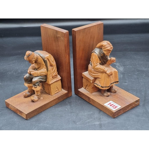 1415 - A pair of Black Forest carved wood figural bookends, 16.5cm high; together with an Indian carved woo... 