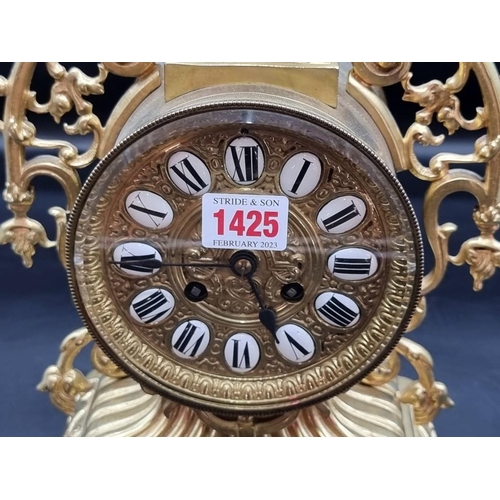 1425 - A brass mantel clock, with enamel chapter ring, 41.5cm high, with pendulum and winding key.&nbs... 