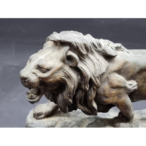 1443 - Jean Barnard Descomps, a gilt bronze lion, signed, 25.5cm wide. 