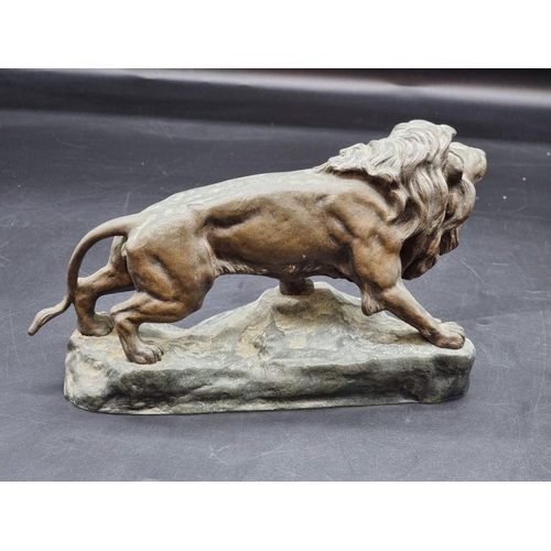 1443 - Jean Barnard Descomps, a gilt bronze lion, signed, 25.5cm wide. 