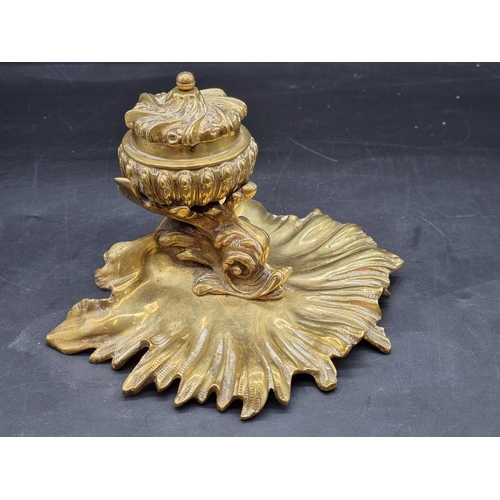 1451 - A rococo style brass dolphin and shell inkwell, 13.5cm high.