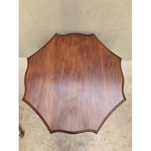 1631 - An Edwardian walnut octagonal occasional table, 79cm diameter.