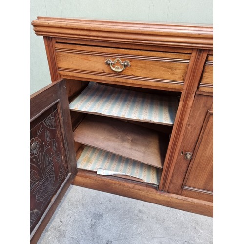 1620 - A late Victorian walnut side cabinet, 118cm wide.