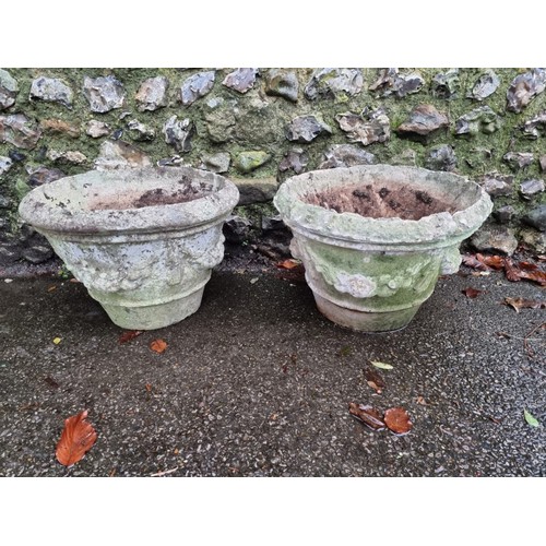 1634 - A pair of old weathered composition stone garden urns, 49cm diameter, (rim chips).