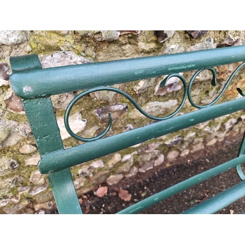 1646 - A green painted wrought iron bench, 117cm wide.