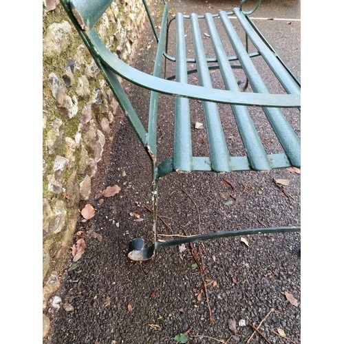 1646 - A green painted wrought iron bench, 117cm wide.