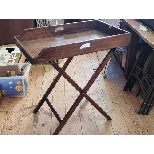 1097 - A George III mahogany butler's tray, 78cm wide, on folding stand.