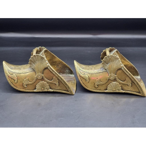 1479 - An interesting pair of antique brass stirrups, with relief decoration, stamped 'Depose', (probably S... 