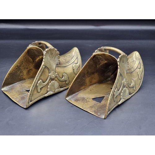 1479 - An interesting pair of antique brass stirrups, with relief decoration, stamped 'Depose', (probably S... 