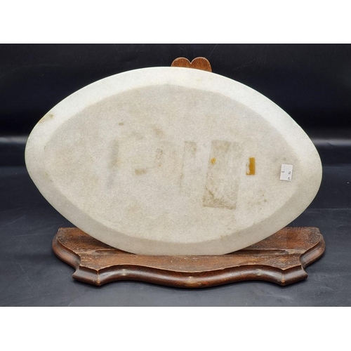 1486 - A marble and pietra dura oval panel, 44.5cm wide, (shallow chips to edge). ... 