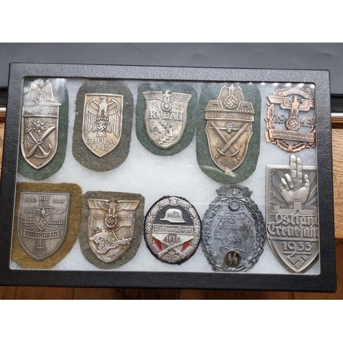 1488 - A collection of German Third Reich medals and badges, to include a large number of reproductions, in... 