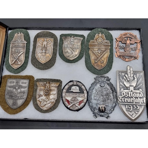 1488 - A collection of German Third Reich medals and badges, to include a large number of reproductions, in... 