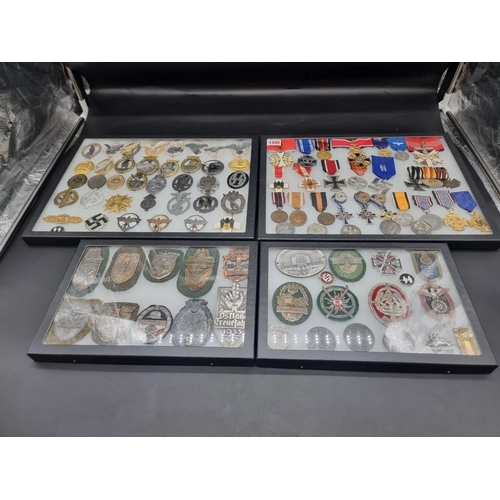 1488 - A collection of German Third Reich medals and badges, to include a large number of reproductions, in... 