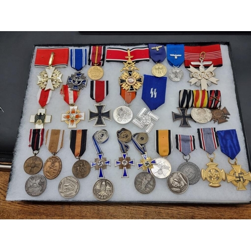 1488 - A collection of German Third Reich medals and badges, to include a large number of reproductions, in... 