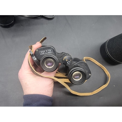 1490 - A pair of 20x80 binoculars, cased; and two other pairs of binoculars. (3) ... 