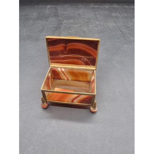 1511 - An antique banded agate and gilt brass mounted casket, 7cm wide. 