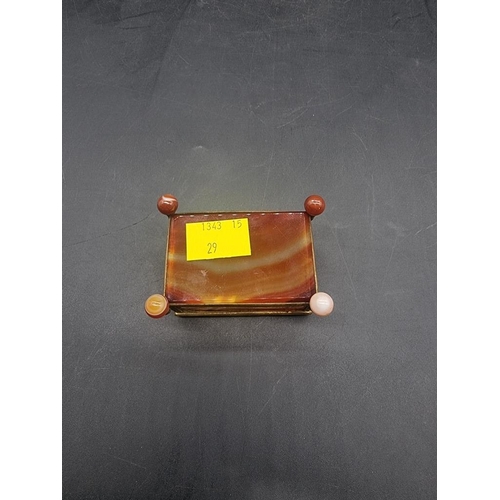 1511 - An antique banded agate and gilt brass mounted casket, 7cm wide. 