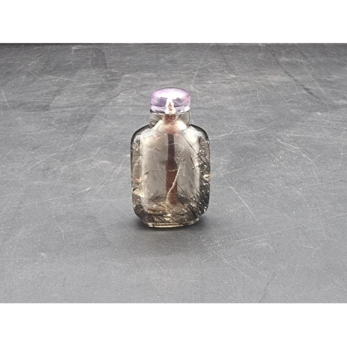 1525 - A Chinese banded agate snuff bottle, with jade stopper, 7.7cm high; together with another rock cryst... 