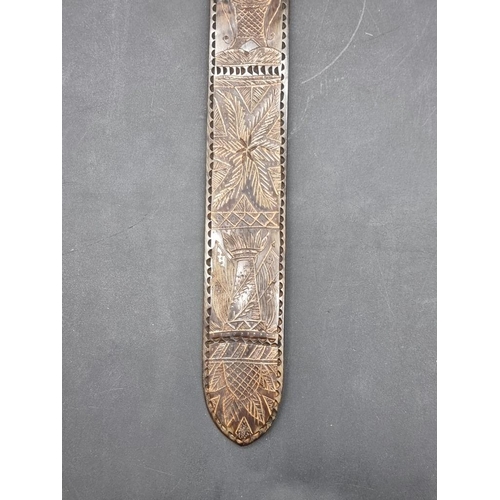 1535 - An antique carved horn stay busk, 30.5cm long.  