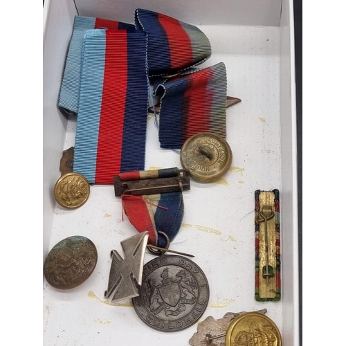 1544 - A collection of badges, medals, military ribbons and dog tags, to include a reproduction Waterl... 