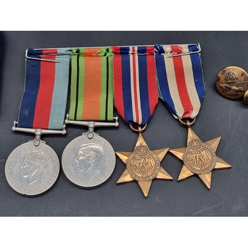 1550 - Medals: a World War II group of four, together with related buttons; photograph; and RAF Service and... 