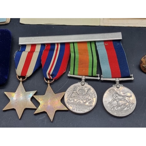 1550 - Medals: a World War II group of four, together with related buttons; photograph; and RAF Service and... 