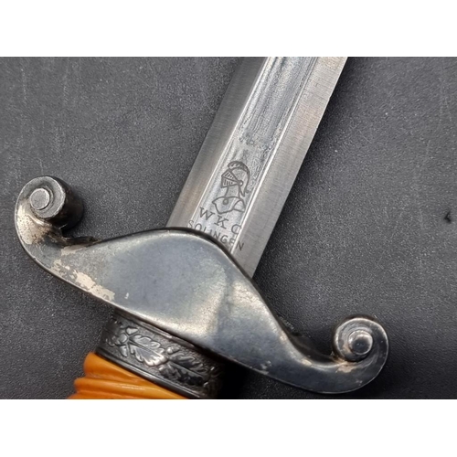 1555 - A German Third Reich army officer's dagger and sheath, with orange grip, maker WKC.