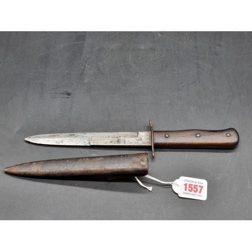 1557 - A World War II Luftwaffe boot knife and sheath, the blade inscribed '5'.