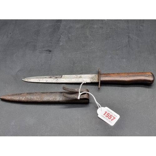 1557 - A World War II Luftwaffe boot knife and sheath, the blade inscribed '5'.