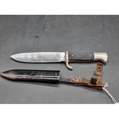 1558 - A German Third Reich Hitler Youth knife and sheath, inscribed 'RZM' and dated 1941. ... 