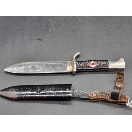 1558 - A German Third Reich Hitler Youth knife and sheath, inscribed 'RZM' and dated 1941. ... 