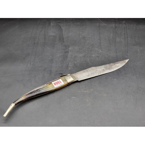 1559 - WITHDRAWN FROM SALE A Spanish navaja folding knife, with ratchet mechanism and horn scales, the blad... 