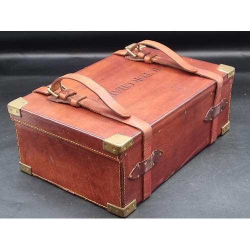 1576 - A tan leather and brass bound cartridge case, labelled 'Peter Chapman, London', the top inscribed 'V... 