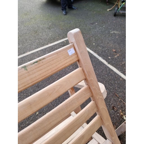 1645 - A pair of teak garden armchairs, labelled 'Lindsey', 64cm wide.